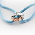 Image 2 of Bracelet made of light blue satin cord with two-tone gold rings; Løve