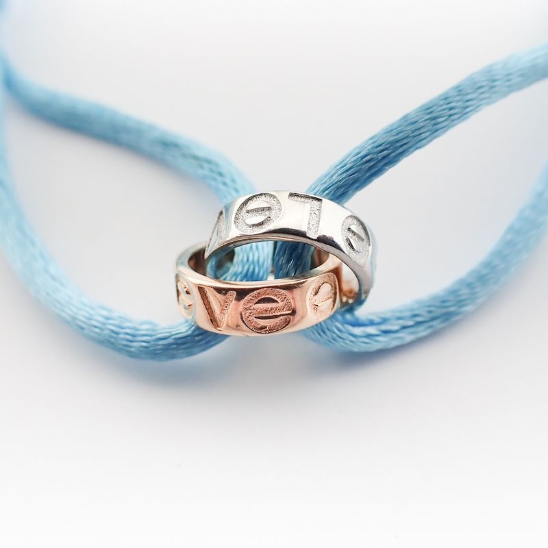 Image 2 of Bracelet made of light blue satin cord with two-tone gold rings; Løve