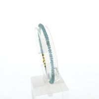 Gold beaded bracelet with aquamarine