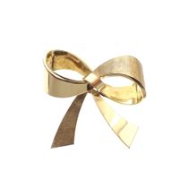 Gold brooch with a bow