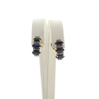 Bicolor gold stud earrings with sapphire and diamond | 0.20 ct. Image 1 of Bicolor gold stud earrings with sapphire and diamond | 0.20 ct.