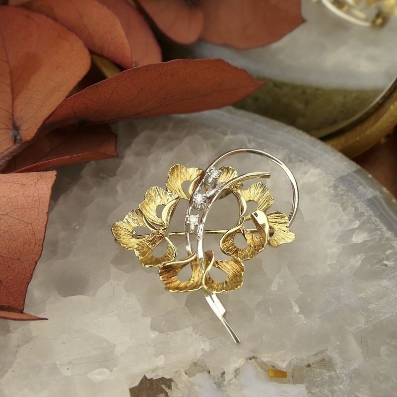 Image 2 of Two-tone gold floral brooch with diamonds