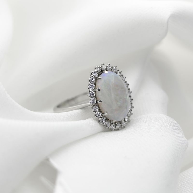 Image 4 of 18-karat white gold ring with opal and entourage of diamonds | 0.60 ct.