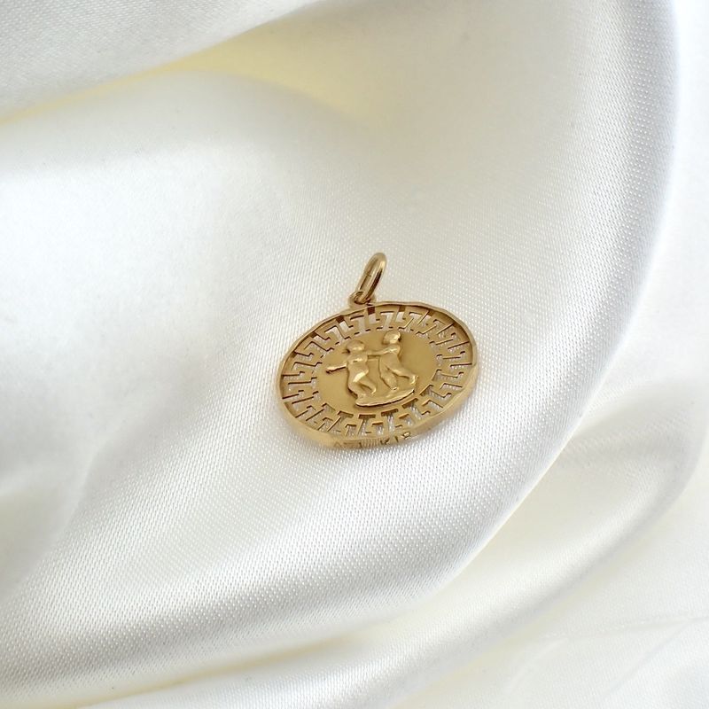 Image 2 of 18 kt gold pendant of the Gemini zodiac sign