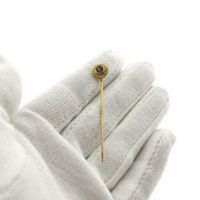 Gold lapel pin with zirconia