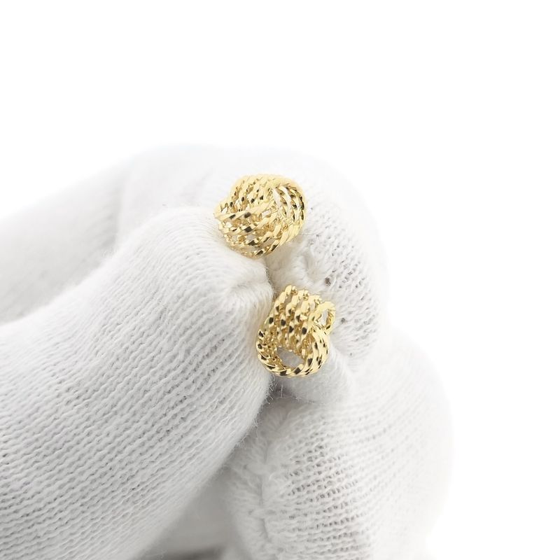 Image 10 of Gold twisted stud earrings as a button
