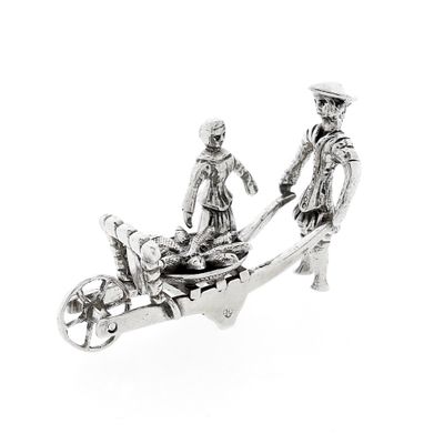 Image 1 of Antique silver statuette of a man and woman with a wheelbarrow