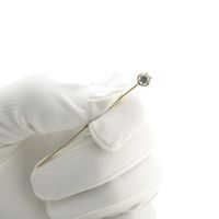 Gold lapel pin with zirconia