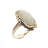 Gold ring with white opal