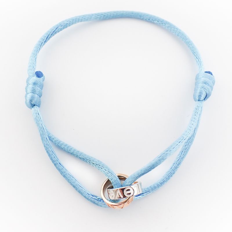 Image 4 of Bracelet made of light blue satin cord with two-tone gold rings; Løve