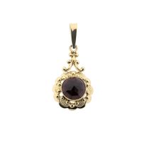 Vintage gold pendant with garnet