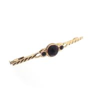 Vintage gold brooch with garnet