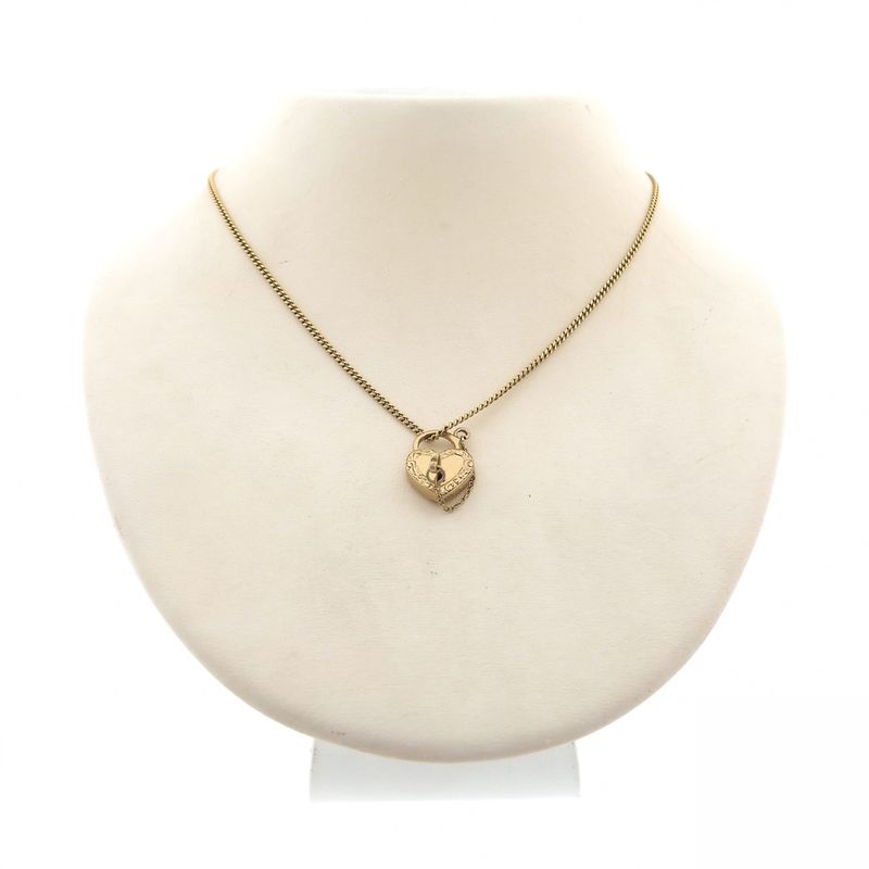 Image 7 of Gold pendant of a heart with a key