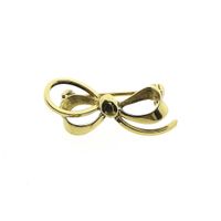 Gold brooch as a bow