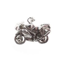 Silver pendant of a motorcycle