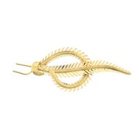 Vintage gold brooch of a feather