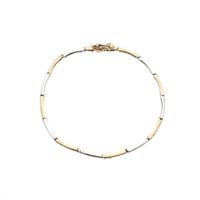 Two-tone gold fantasy link bracelet with zirconia.