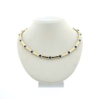 Two-tone gold fantasy necklace with sapphire