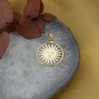 Image 2 of 18-karat gold pendant of a sun with a face | St. Moritz