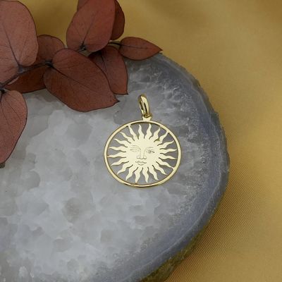 Image 2 of 18-karat gold pendant of a sun with a face | St. Moritz