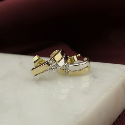 Image 2 of Bicolor gold stud earrings with diamond; 0.08 ct.