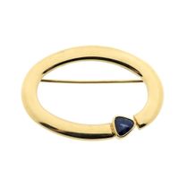 Gold brooch with sapphire