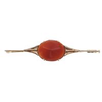 Antique gold brooch with carnelian