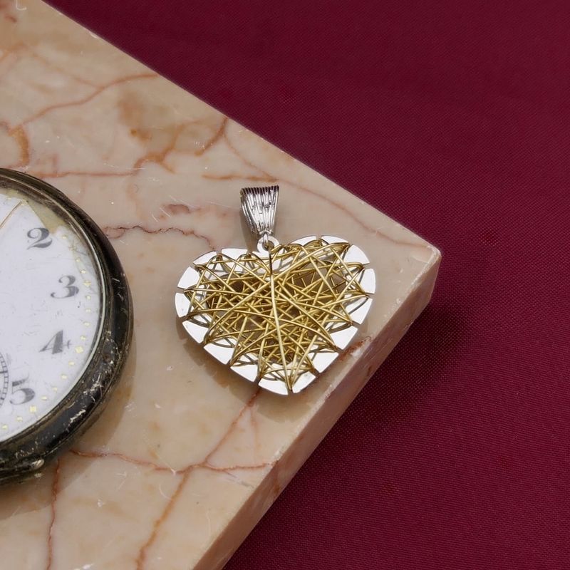Image 2 of Two-tone gold pendant of a heart with gold threads