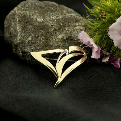 Image 1 of Two-tone gold fantasy brooch with diamond; 0.005 ct.