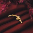 Image 2 of Gold pendant of a revolver.