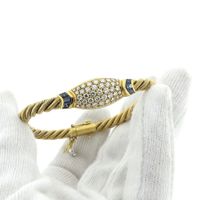 18-karat gold twisted bracelet with sapphire and diamond; 1.11 ct. | Wellendorff