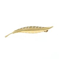 Gold feather brooch