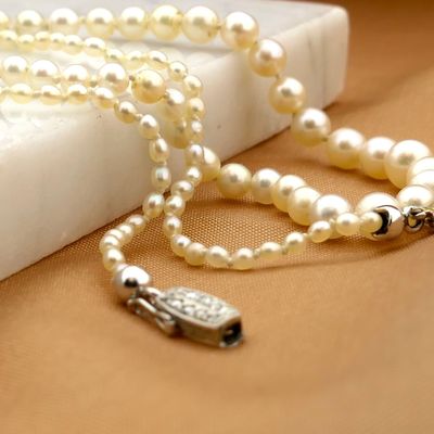 Image 2 of Pearl necklace with white gold clasp and diamonds; 0.06 ct.