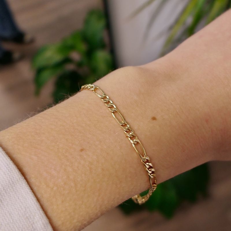 Image 4 of Gold closed Figaro link bracelet.