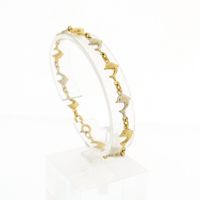Two-tone gold dolphin bracelet