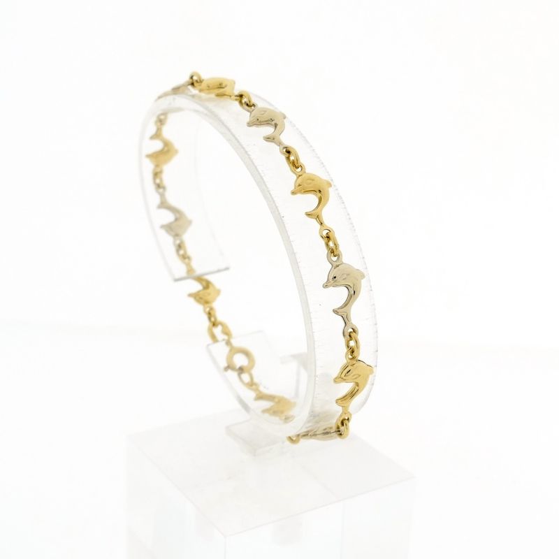 Image 1 of Two-tone gold dolphin bracelet