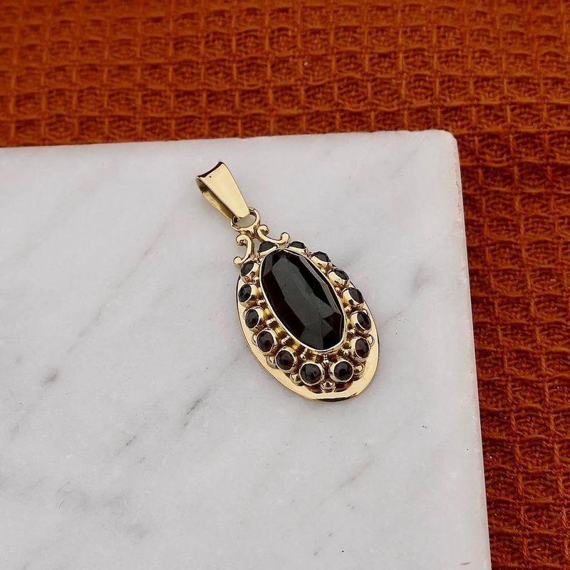 Image 2 of Gold Pendant with Garnet