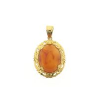 Gold pendant with carnelian