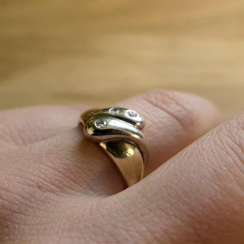 Image 7 of Two-tone gold solitaire ring with 0.105 ct diamond.