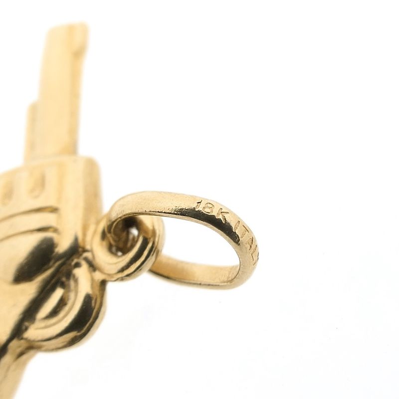 Image 8 of 18 carat gold pendant of a revolver.