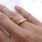 Image 4 of Subtle gold ring with 0.015 ct diamond.