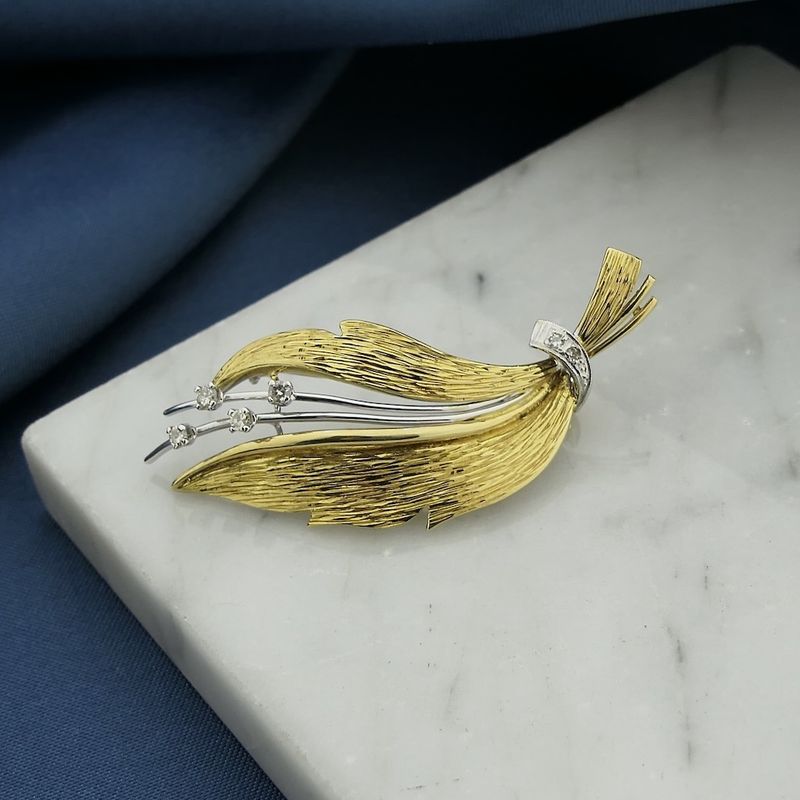 Image 9 of Two-tone gold brooch of a leaf with diamonds; 0.12 ct.