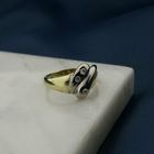 Image 2 of Two-tone gold solitaire ring with 0.105 ct diamond.