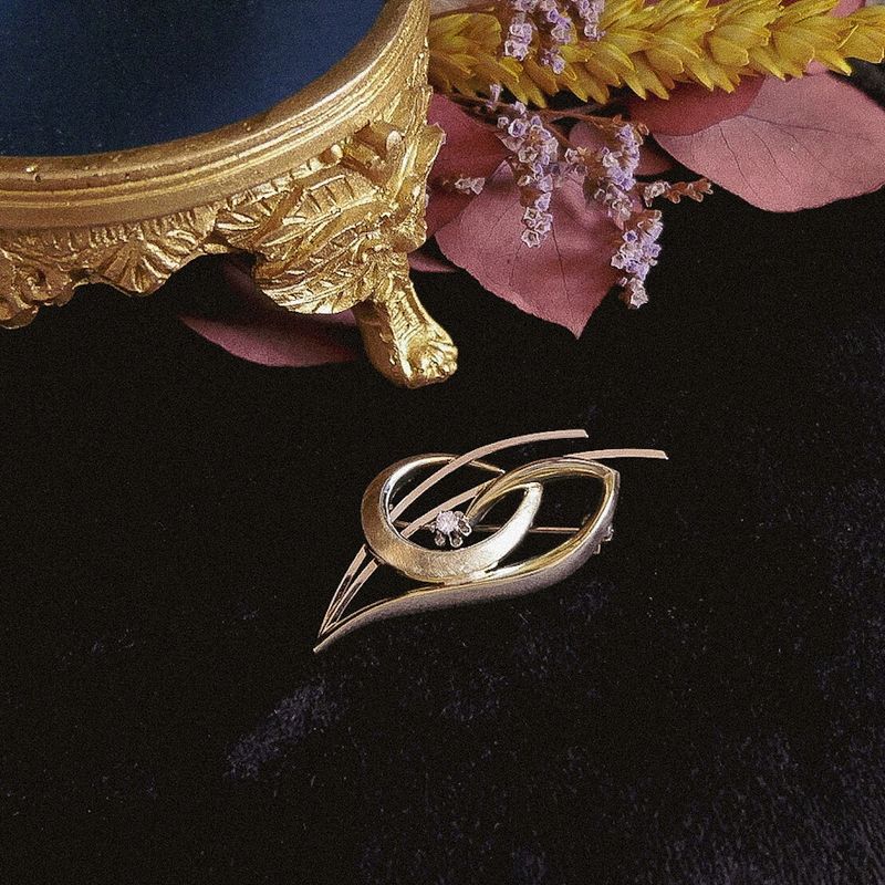 Image 2 of Two-tone dynamic brooch with diamond; 0.05 ct.