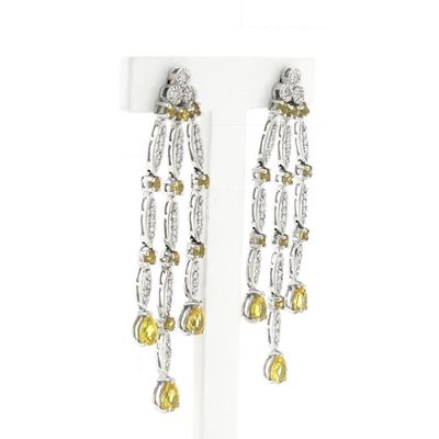 Image 2 of White gold stud earrings with yellow sapphire and diamond; 0.56 ct.