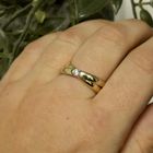 Image 10 of Gold crossover ring with diamond; 0.12 ct.