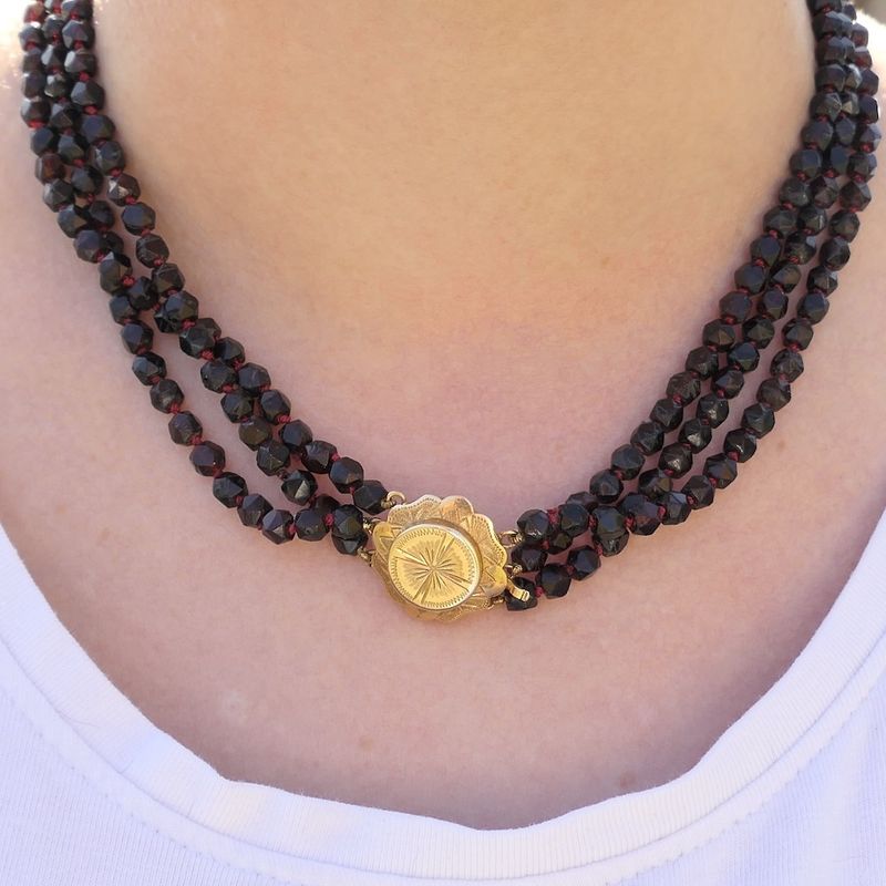 Image 11 of Antique garnet bead necklace with gold decorative clasp.