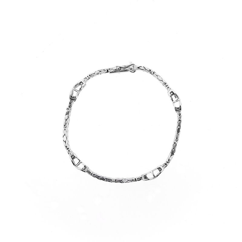 Image 3 of White gold flat king bracelet with fixed charms and 0.24 ct diamond.