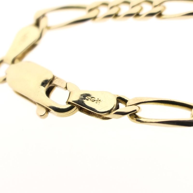 Image 7 of Gold closed Figaro link bracelet.