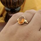 Image 6 of Gold ring set with synthetic orange gemstone